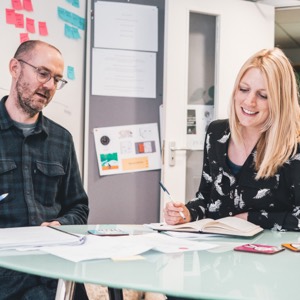 Two people working on strategy at Liquid Light